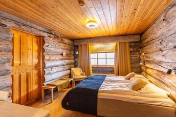 Фото номера Двухместный номер с 2 отдельными кроватями Гостевой дом Log House Kuukkeli Teerenpesä г. Саариселькя 6