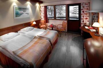 Фото номера Стандартный двухместный номер с 2 отдельными кроватями Отель Lapland Hotels Riekonlinna г. Саариселькя 2
